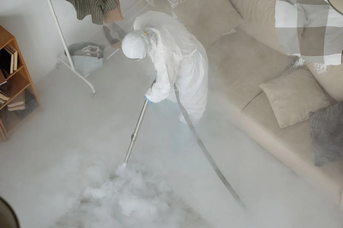 Biohazard cleanup technician in protective equipment, Oakville, CT